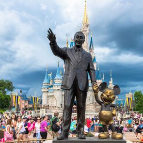 Walt Disney and Mickey Mouse statue inside of the Magic...