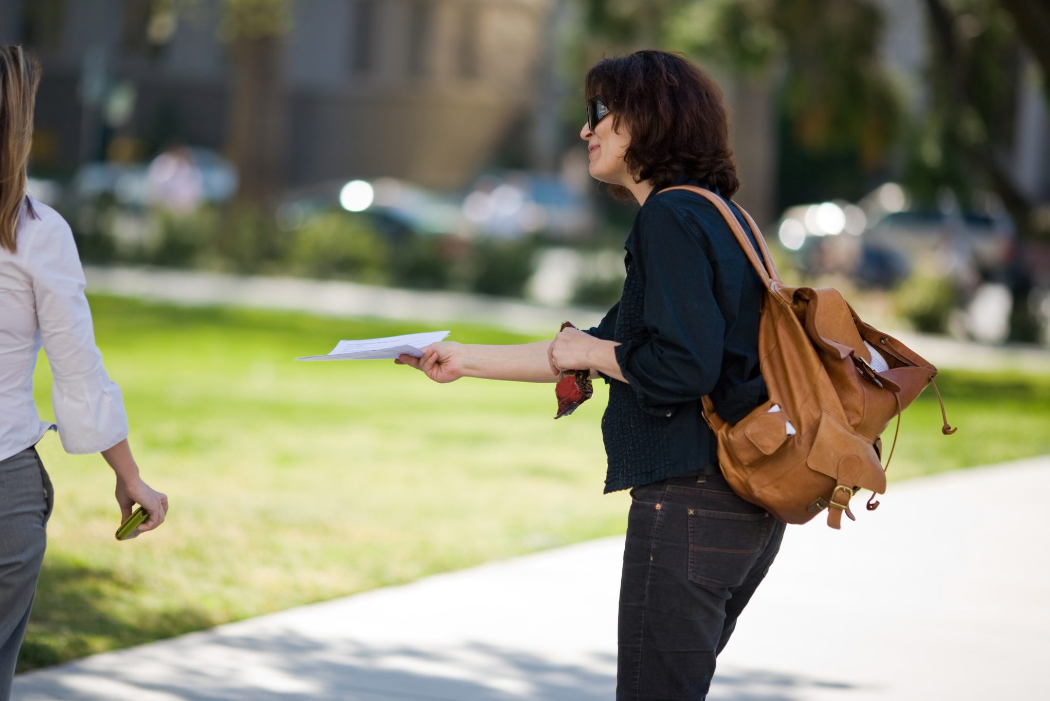 woman Handing Out Fliers