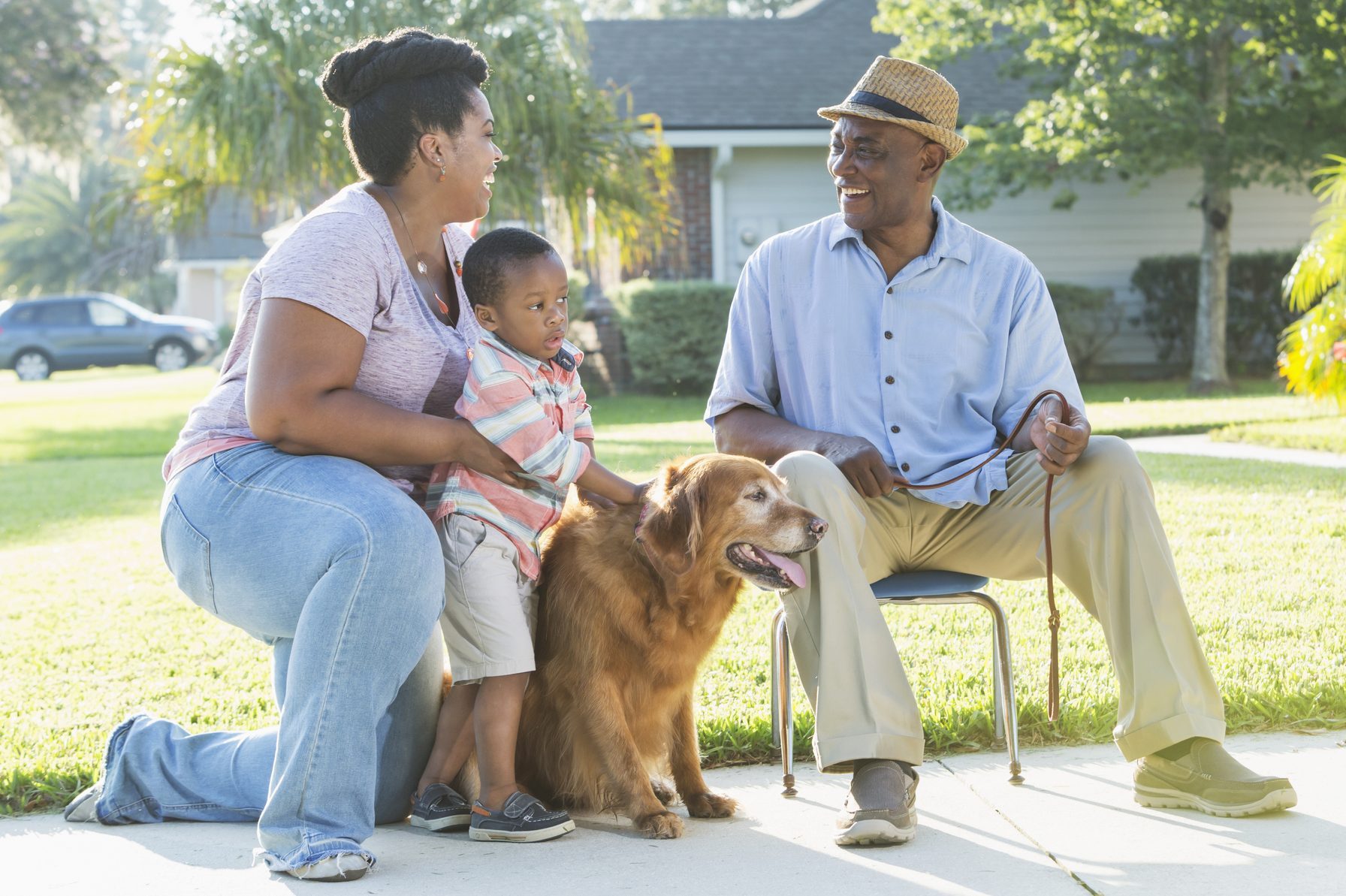 golden retriever with senior and grandkids outside