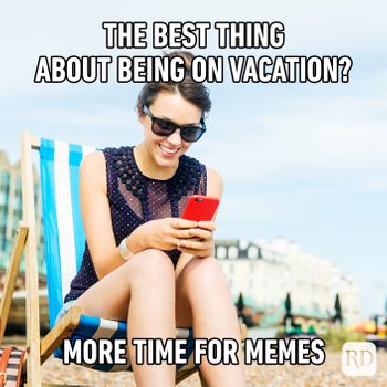 "The best thing about being on vacation? more time for memes" vacation meme of woman on beach laughing at phone screen