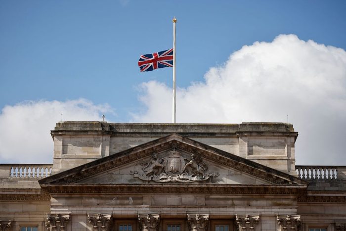 The Union Flag flown at half-mast from the top of Buckingham Palace