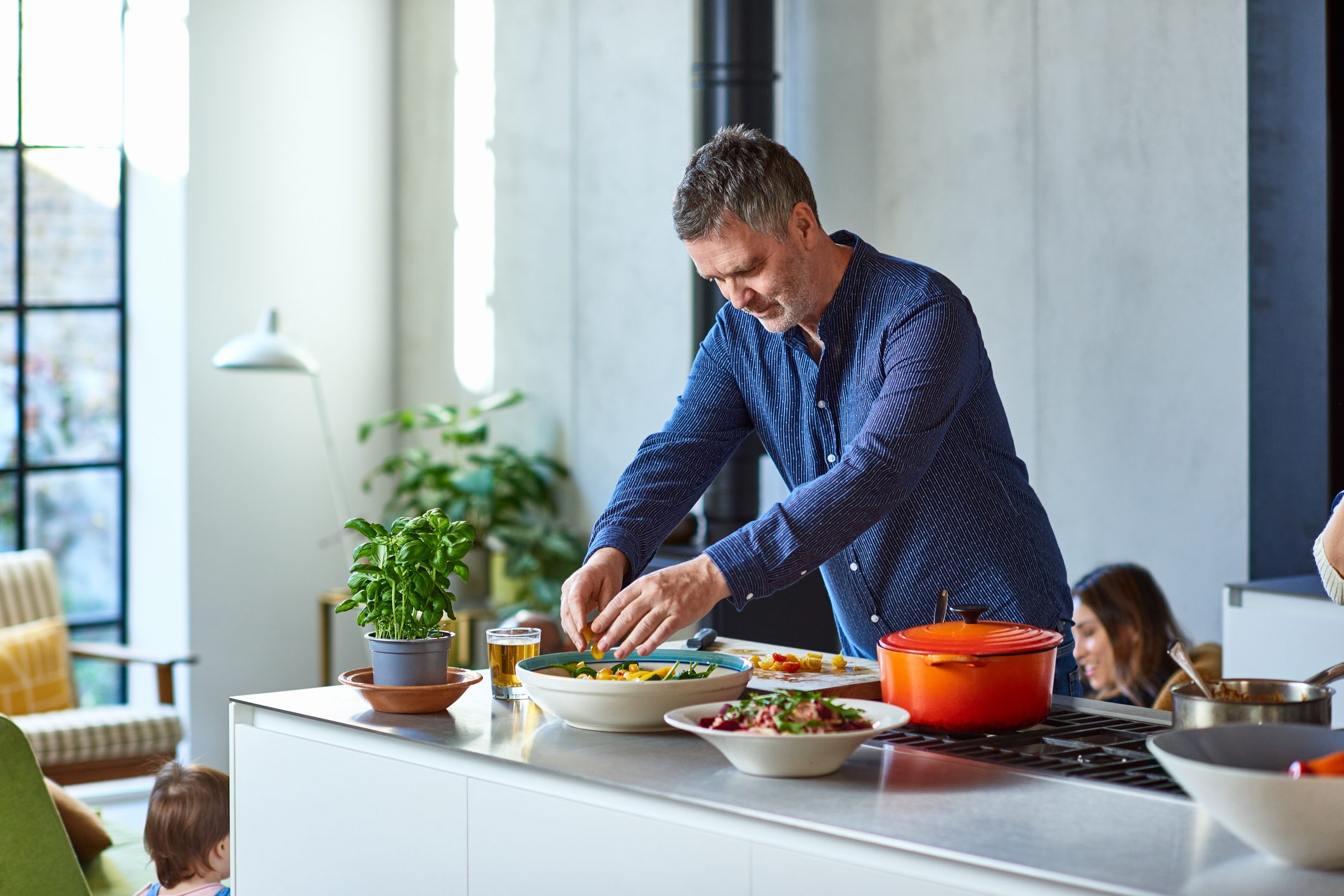 Mature man preparing healthy meal on kitchen counter