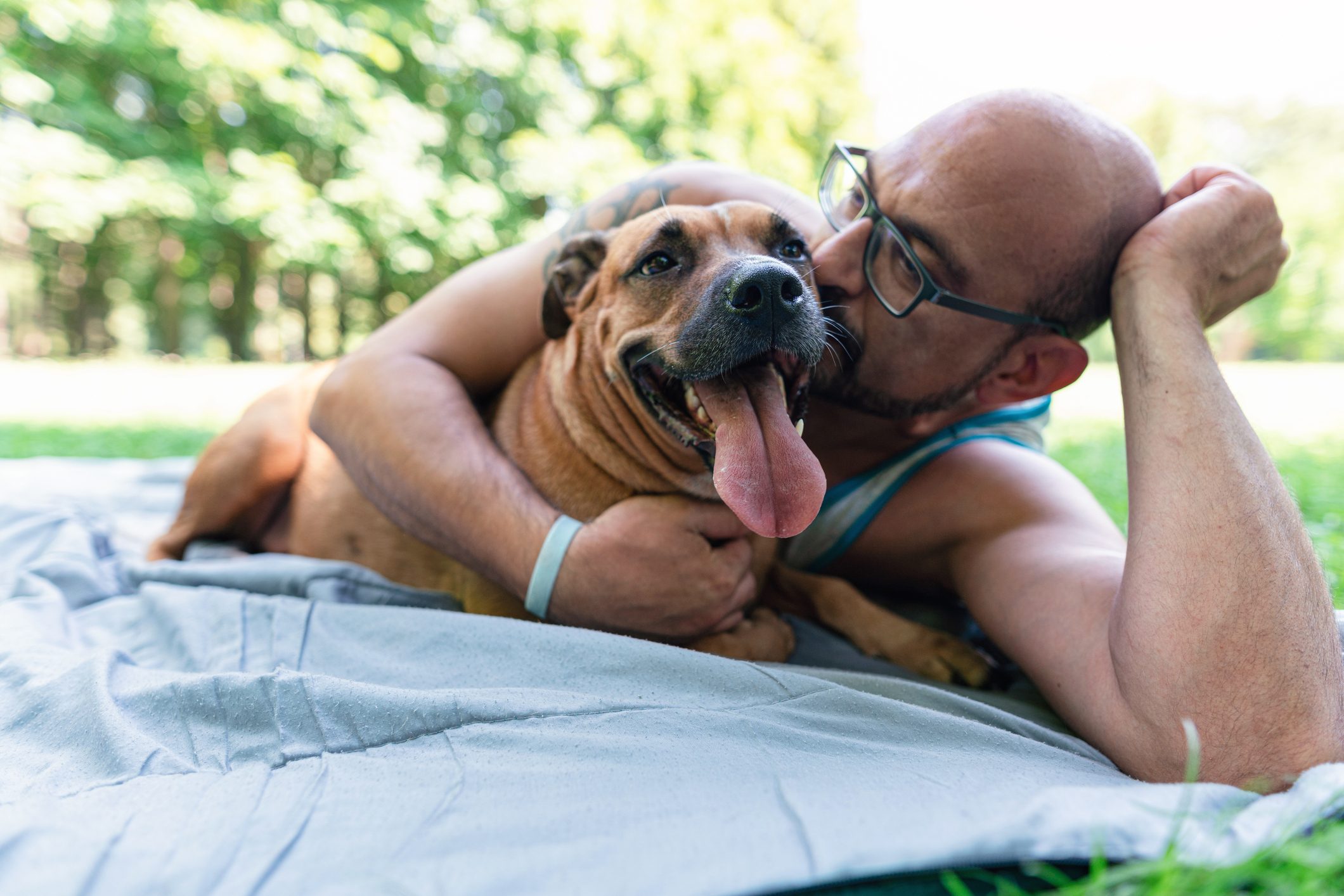 Man with his mixed breed dog in the park