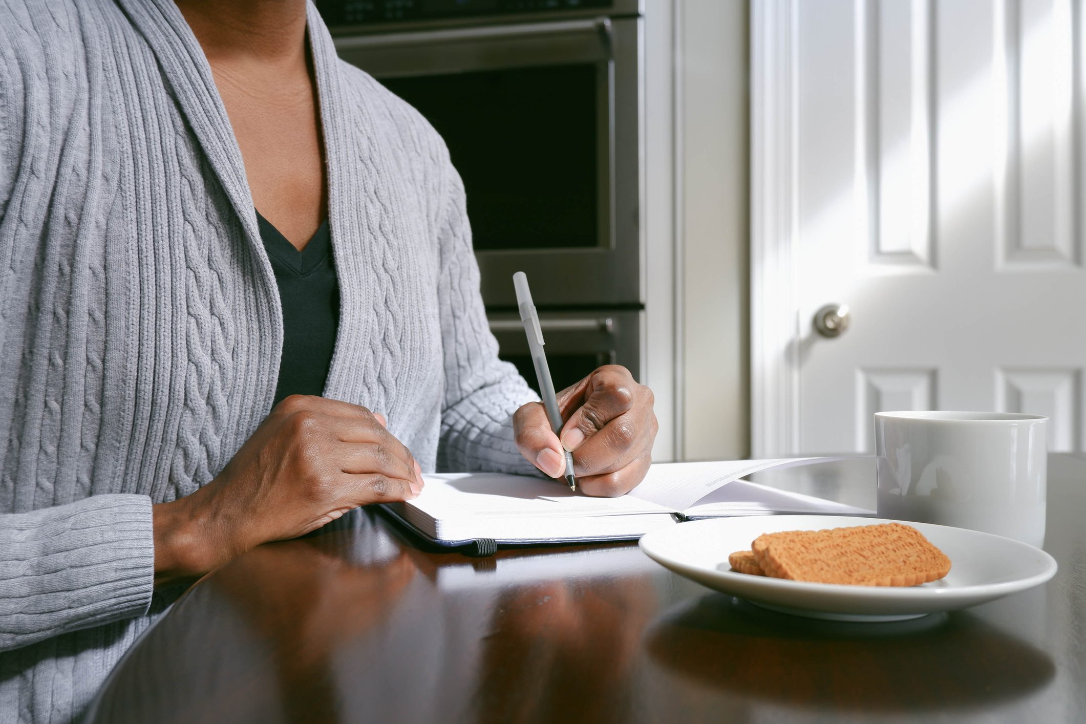 Woman Writes in Journal