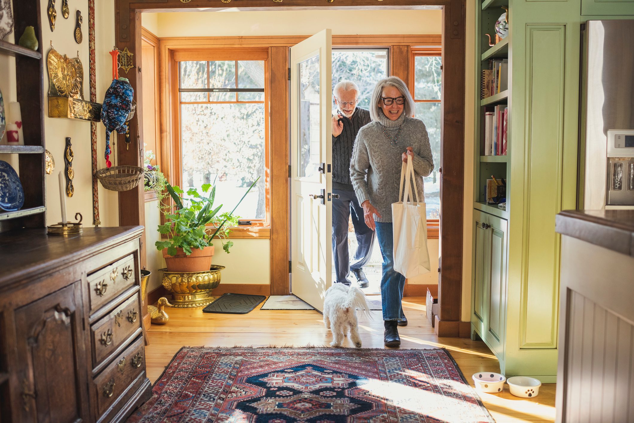 Man and woman arriving home