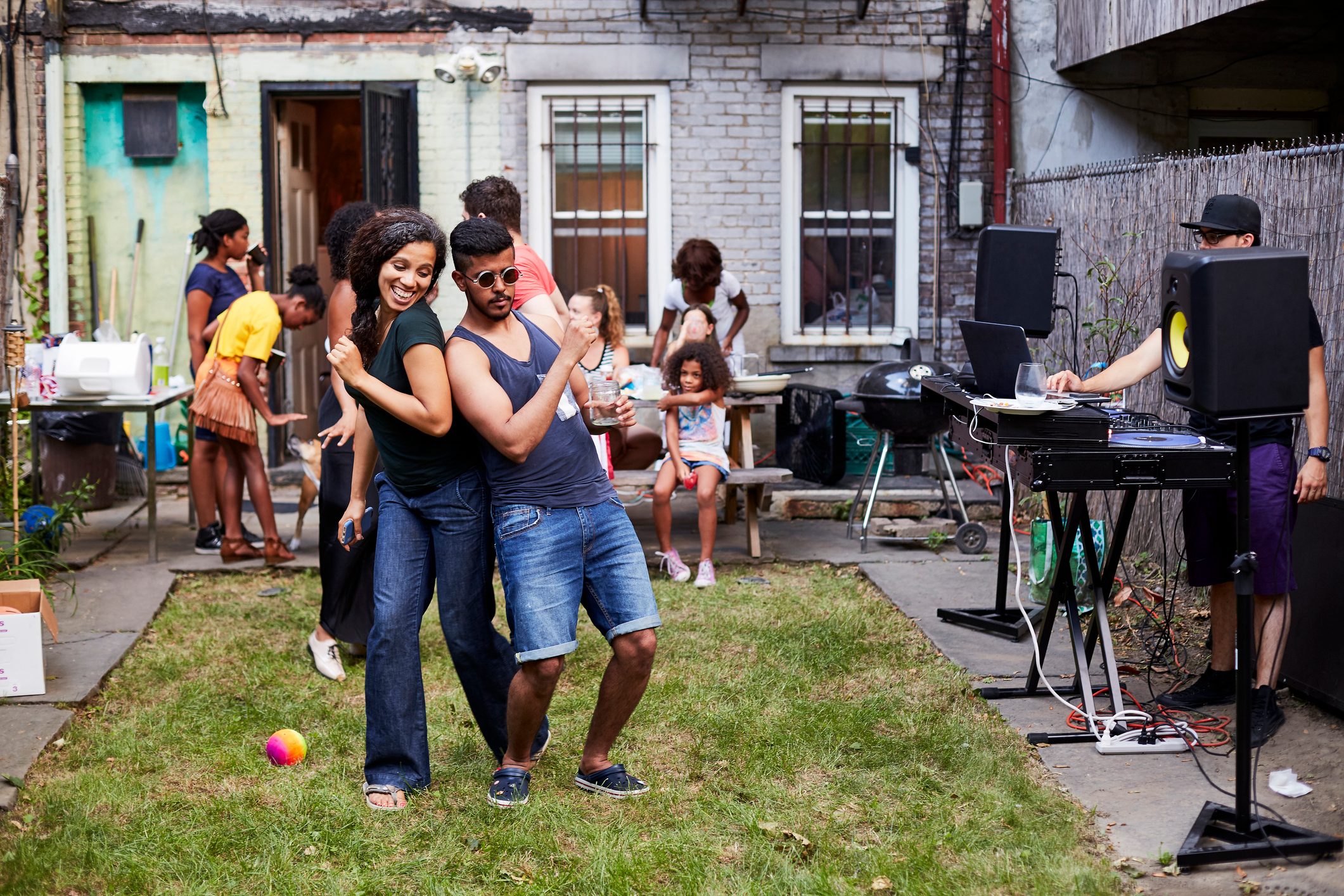 Couple dancing at backyard dance party