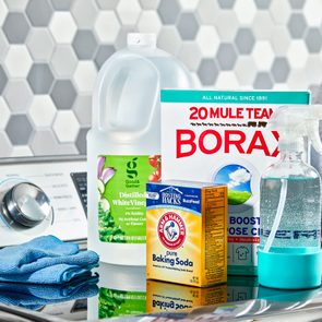 cleaning supplies on a washing machine in a laundry room