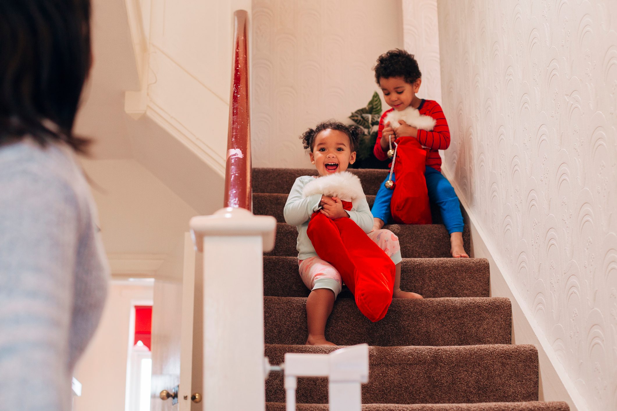 Children Coming Down The Stairs On Christmas Morning