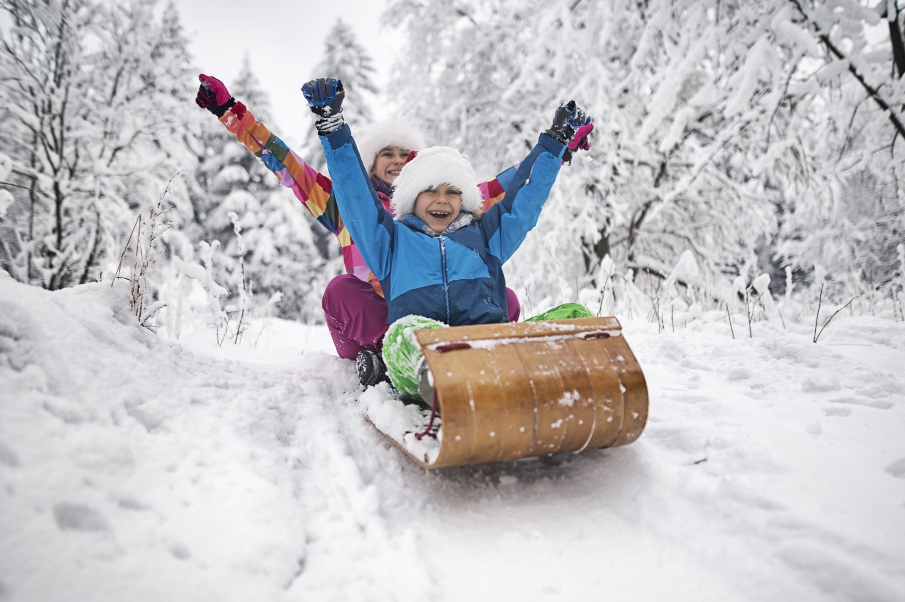Kids tobogganing on Christmas