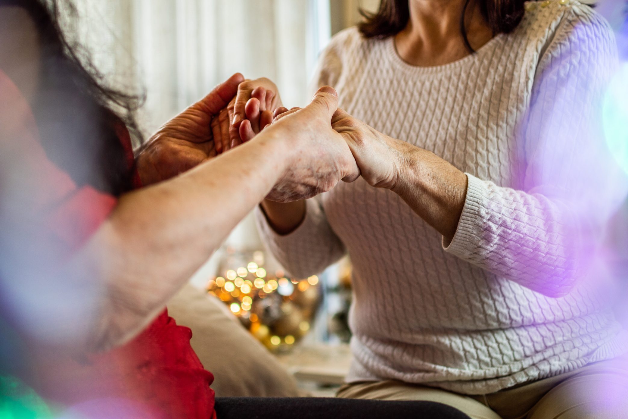 close up of family holding hands