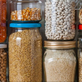 close up of glass jars on a Shelf in a Kitchen Pantry