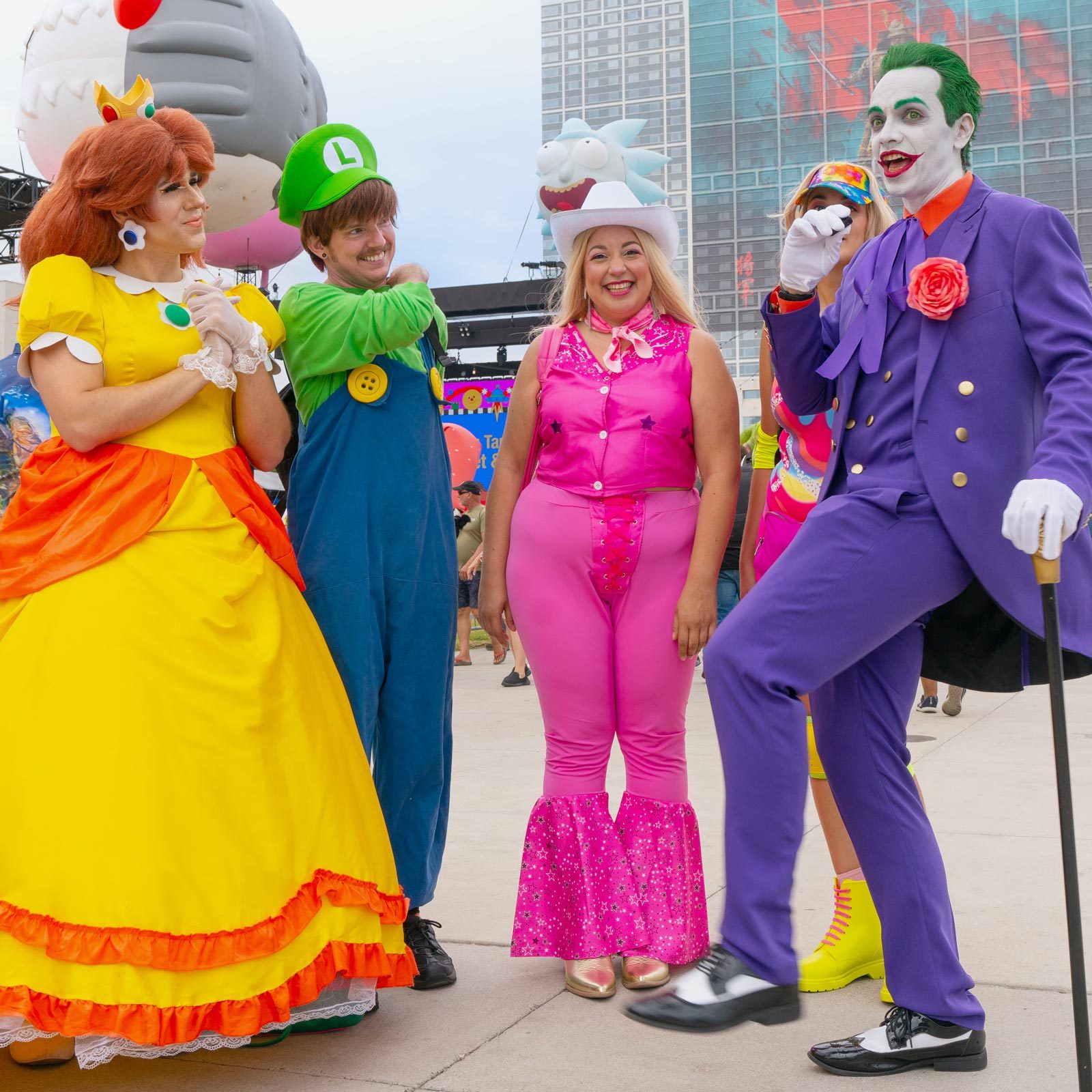 four people in halloween costumes