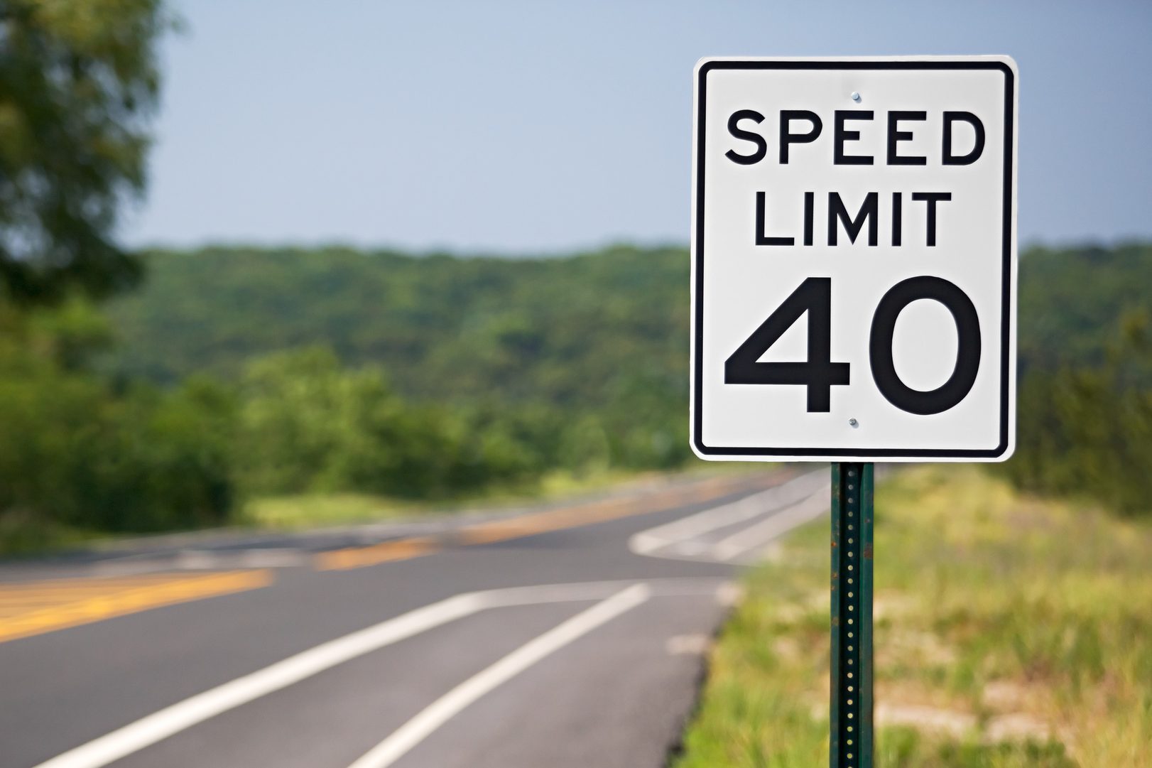 Speed limit sign by the road