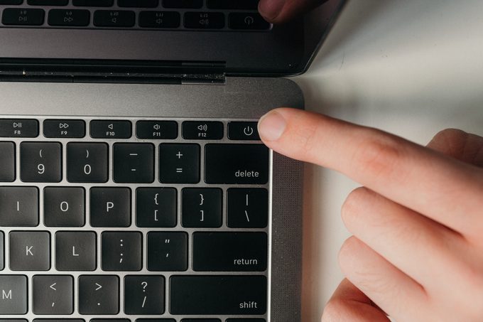 powering down laptop to prepare for cleaning