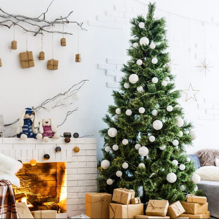 Fireplace and Christmas tree with presents in living room