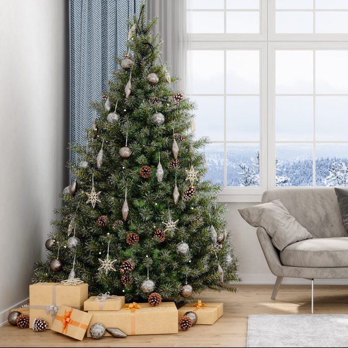 Christmas Tree, Gifts And Sofa With a View Of Snow