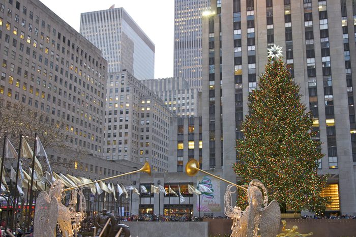 Angels with horns at the rockefellar plaza Christmas tree in new york, NY