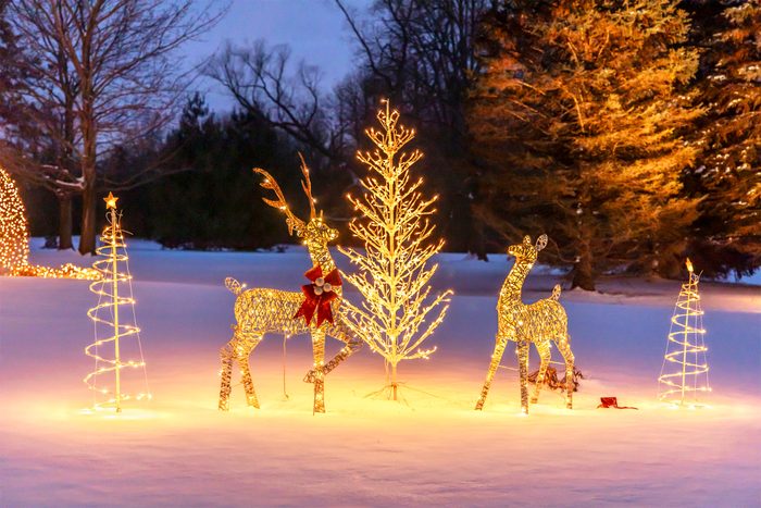 Beautiful, glowing holiday home decorated with Christmas lights.