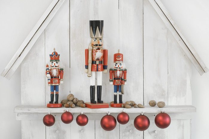 Christmas decoration with three nutcrackers, Christmas baubles and nuts