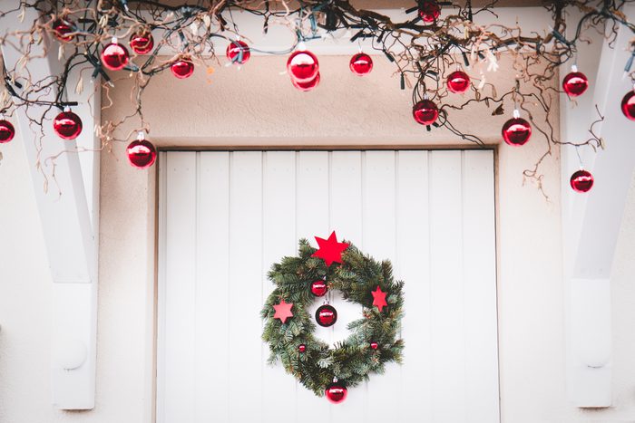 Christmas entrance door decoration white and red with christmas wreath