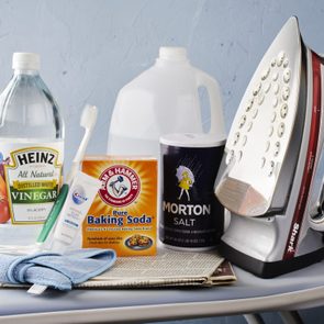 Iron with Cleaning Supplies on ironing board