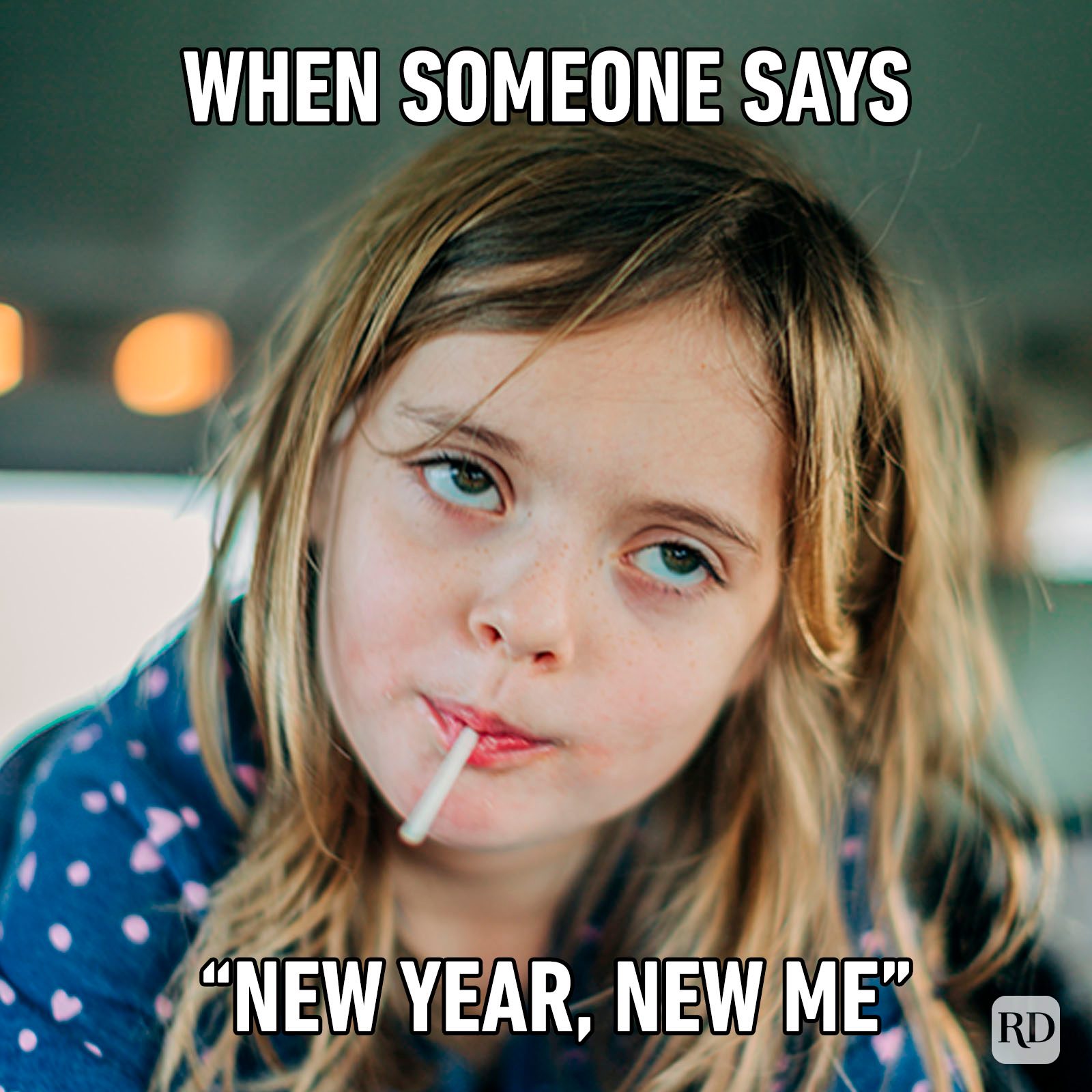 Young, Smiling Girl Looking At Her Reflection In The Mirror