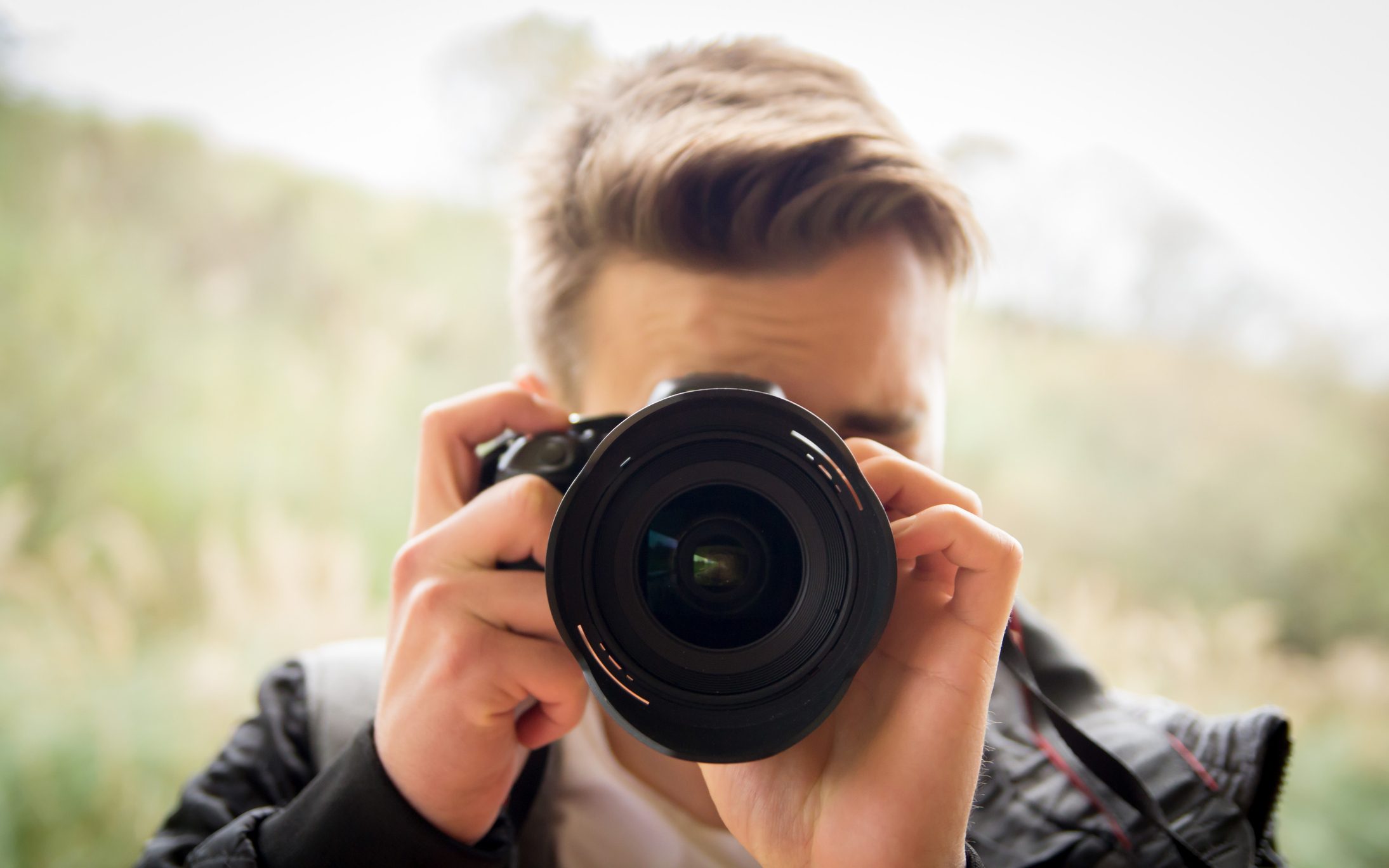 photographer taking a photo asking to "say cheese"
