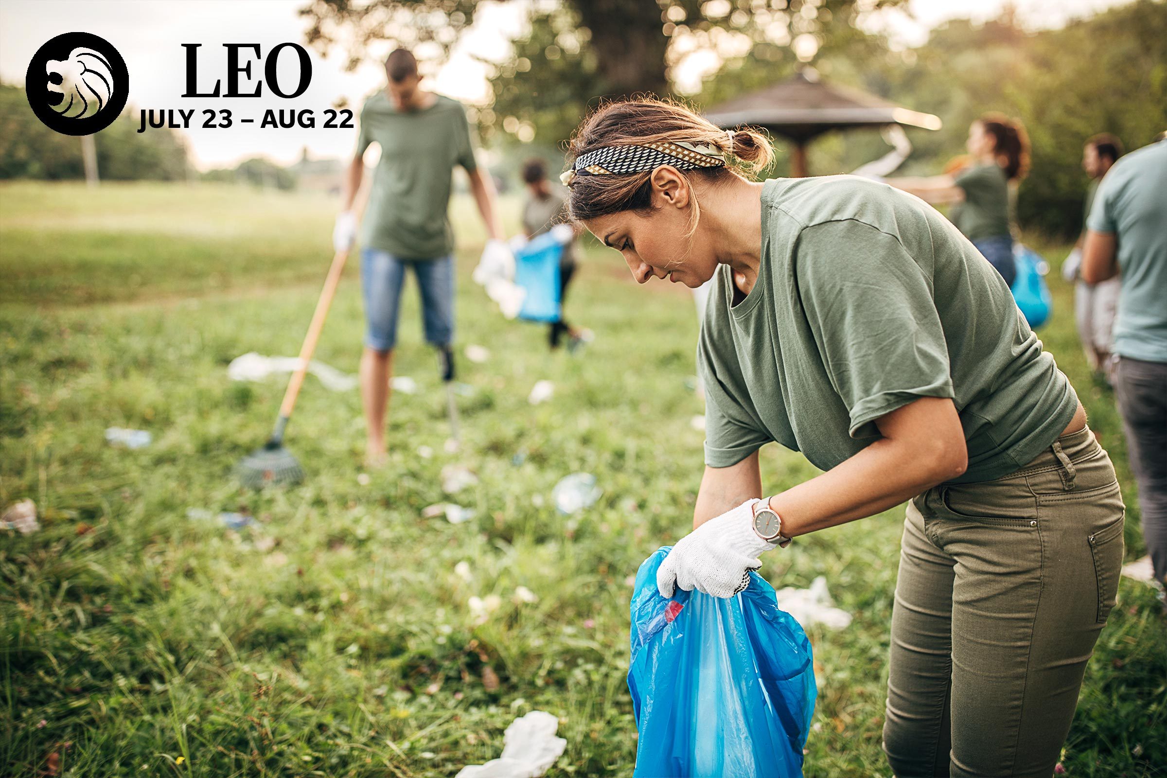 woman picking up trash with a volunteer group