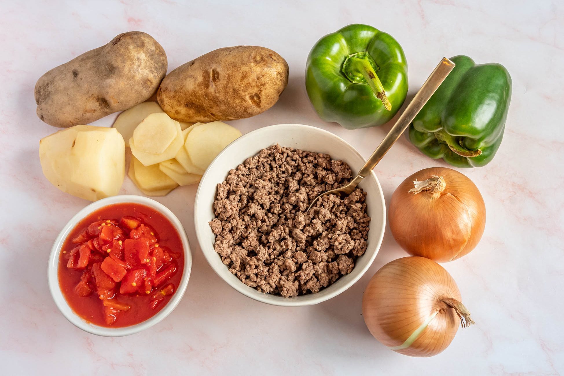 Dolly Parton 5 Layer Casserole Ingredients. Peppers, Onions, Ground beef, potatoes, and more.