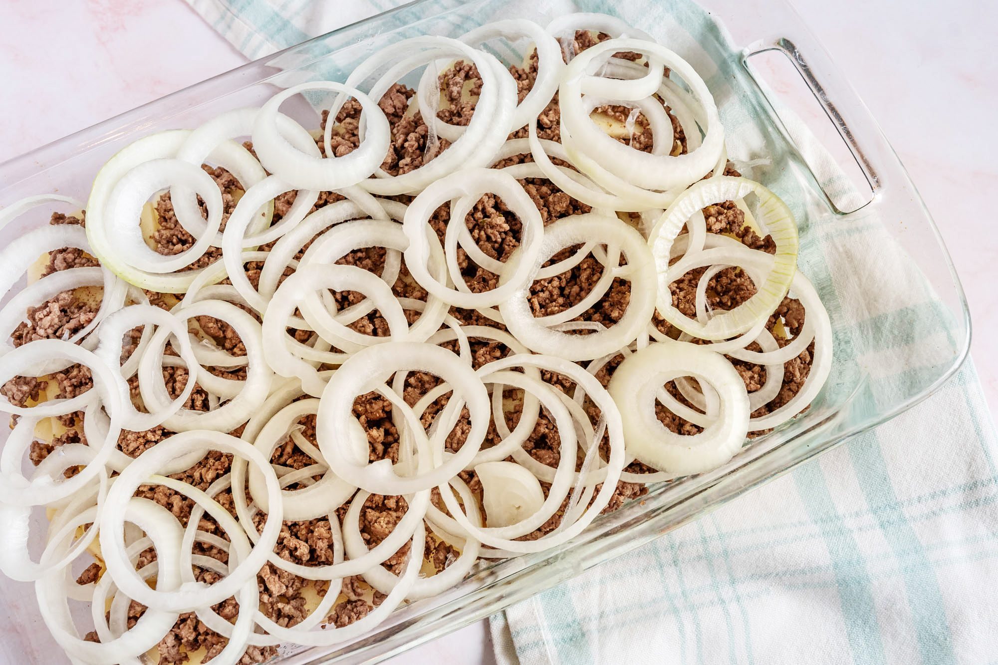 Dolly Parton Casserole Onions layered on top of the ground beef