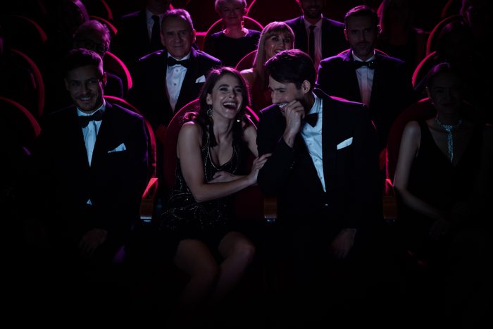 Couple laughing while watching a comedy show