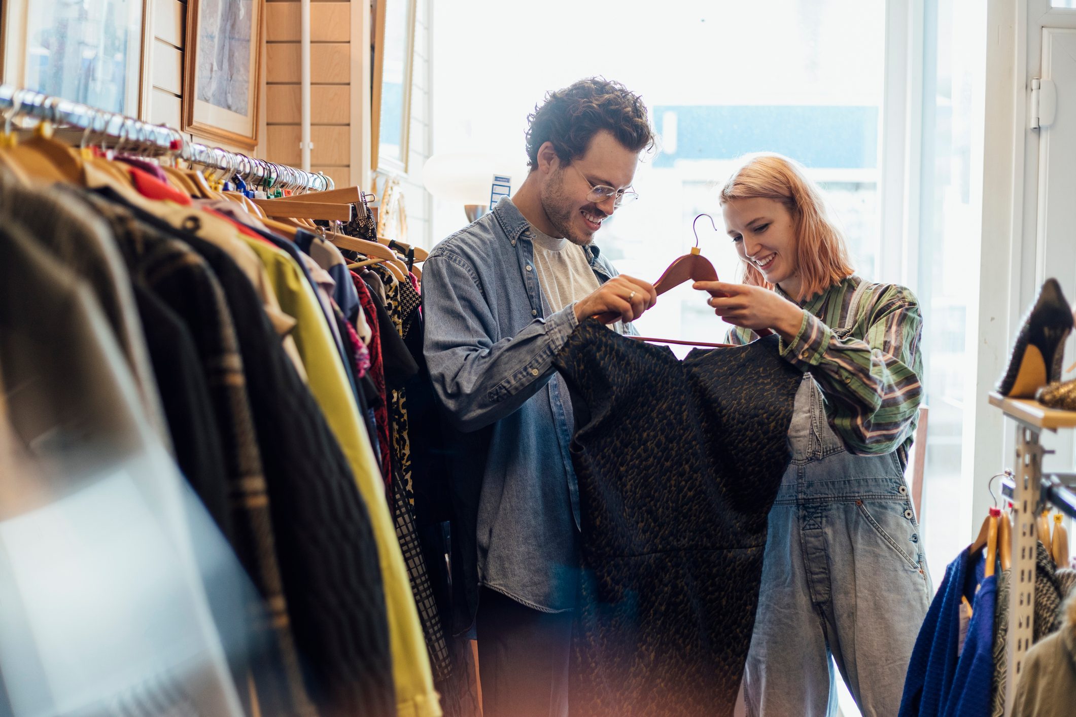 young couple shopping at thrift store together