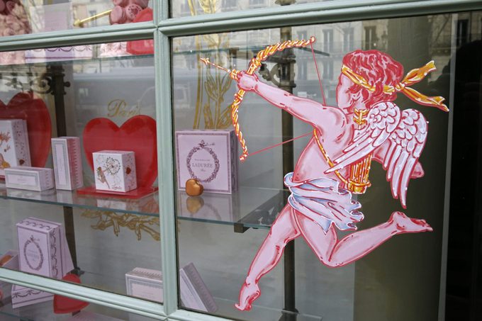 cupid window decal on lauduree storefront in france