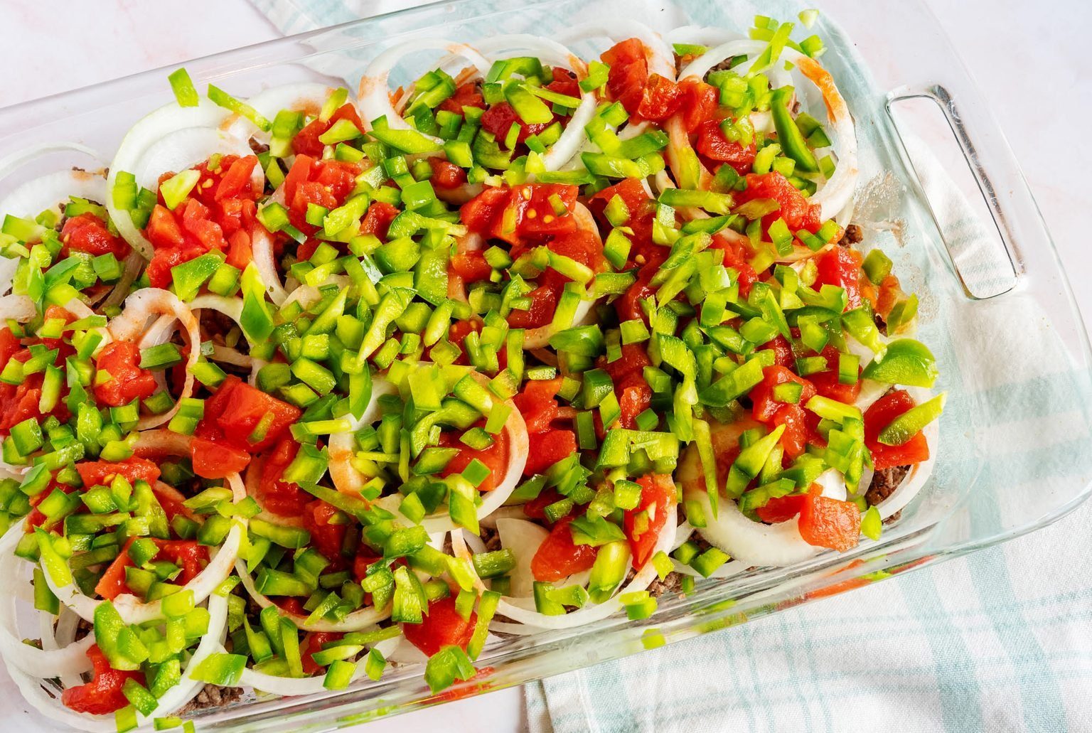 Dolly Parton Casserole Peppers on top of the tomatoes