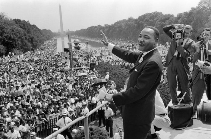 The civil rights leader Martin Luther King (C) waves to supporters 28 August 1963 on the Mall in Washington DC