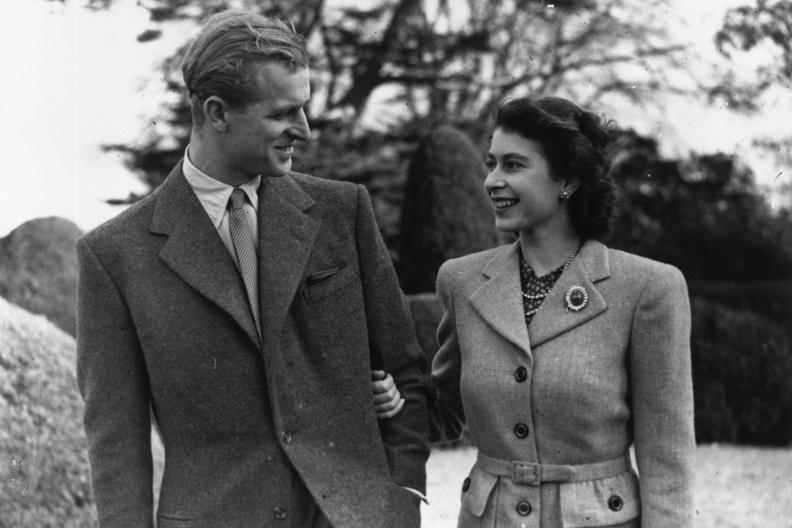 24th November 1947: Princess Elizabeth and The Prince Philip, Duke of Edinburgh enjoying a walk during their honeymoon at Broadlands, Romsey, Hampshire. (Photo by Topical Press Agency/Getty Images)