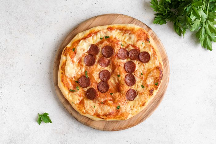 Pi Day Pizza with the pi symbol drawn with pepperoni