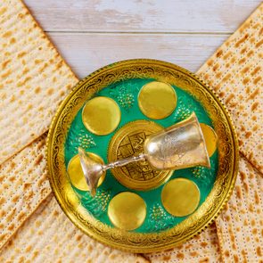 Matzo for Passover on metal seder tray on table