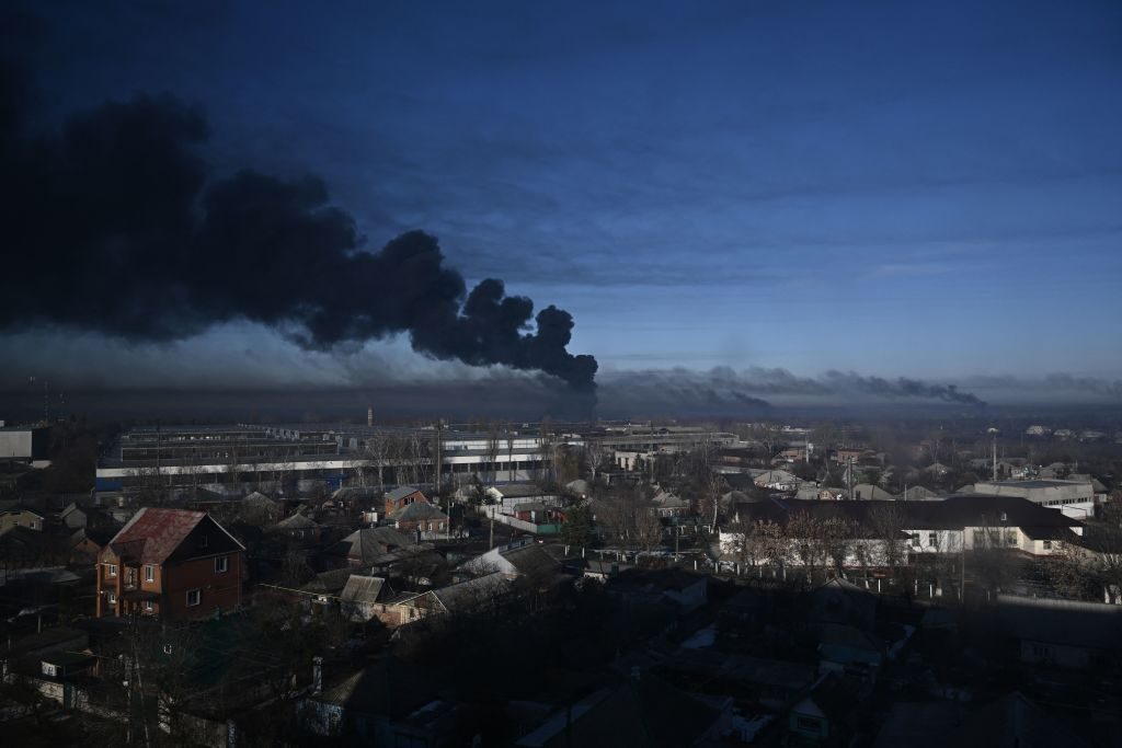 Black smoke rises from a military airport in Chuguyev near Kharkiv on February 24, 2022.