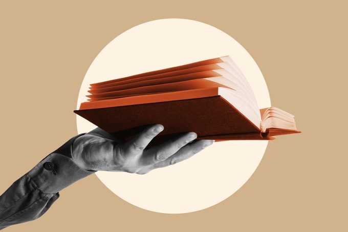 hand holding book in circle