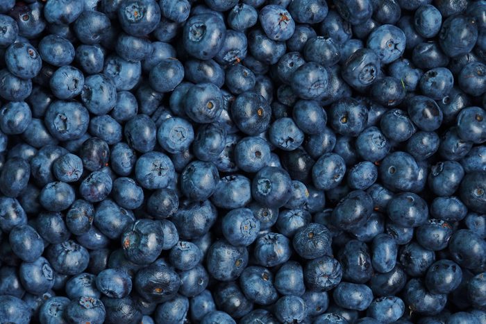 Fresh sweet blueberry background. Vaccinium corymbosum, the northern highbush blueberry. Close-up swamp huckleberry blue-black berry texture, surface