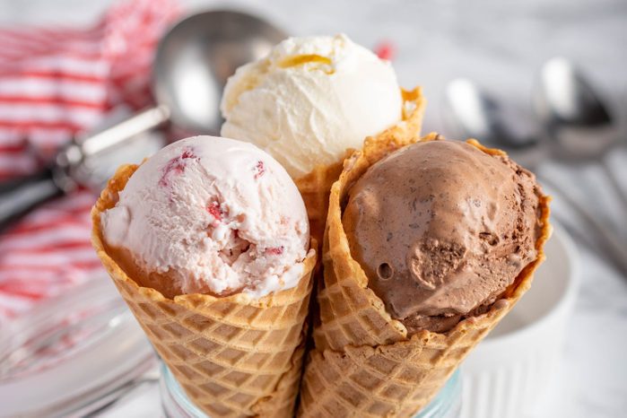 strawberry, vanilla, chocolate ice cream with waffle cone on marble stone backgrounds