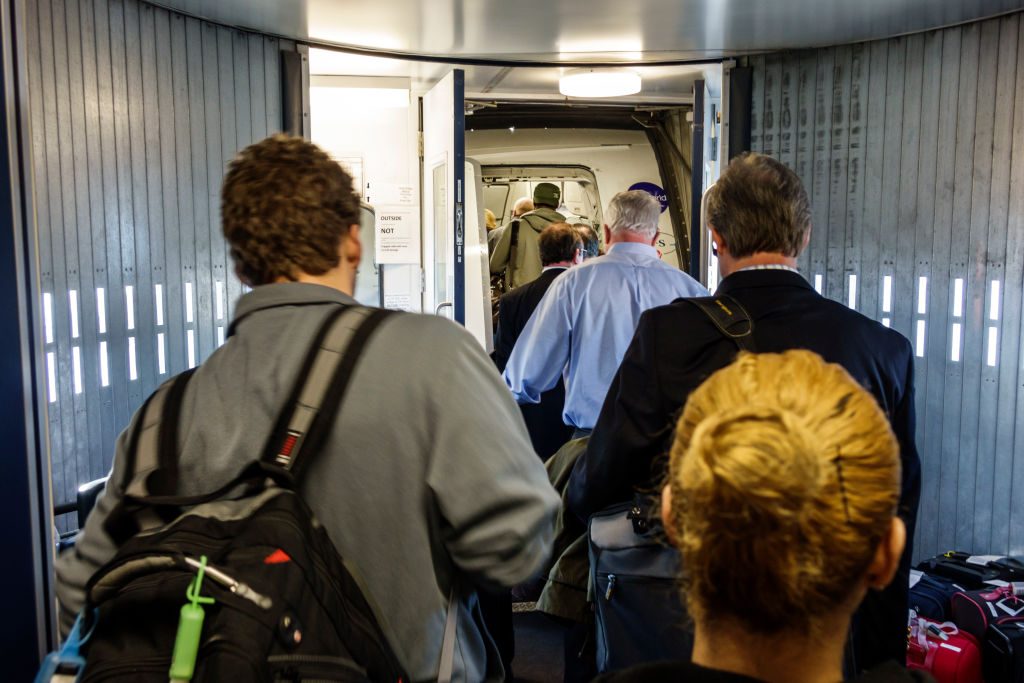 Passengers boarding an airplane