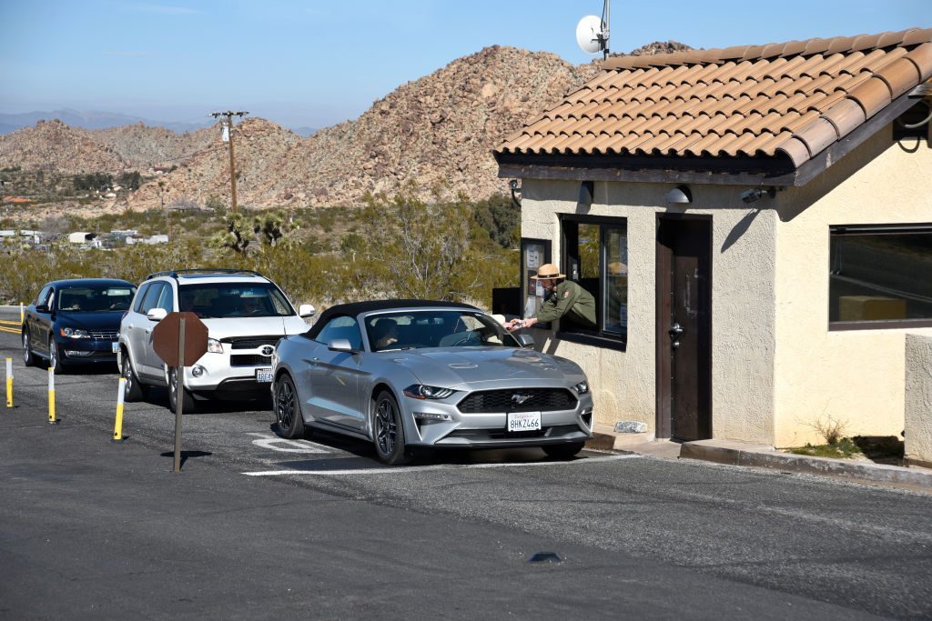 Joshua Tree National Park entrance with a line of cars In California, USA