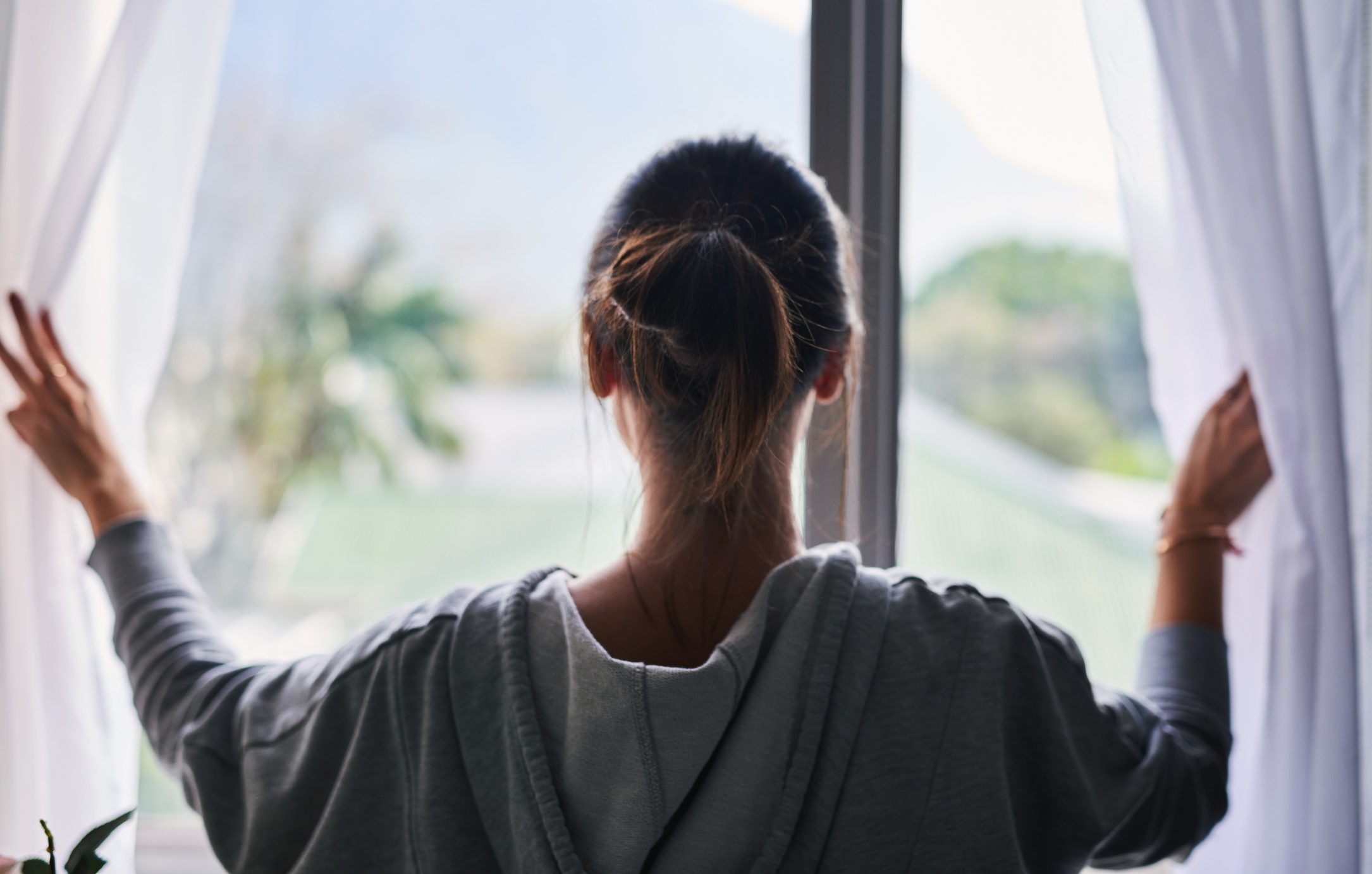 from behind, woman looking out the window on friday the 13th