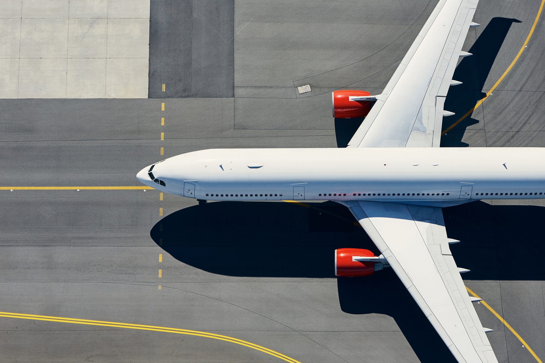 Aerial View Of Airport. Airplane Taxiing To Runway Before Take Off.