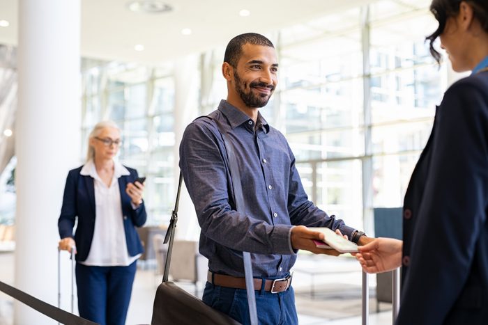 man showing electronic flight ticket