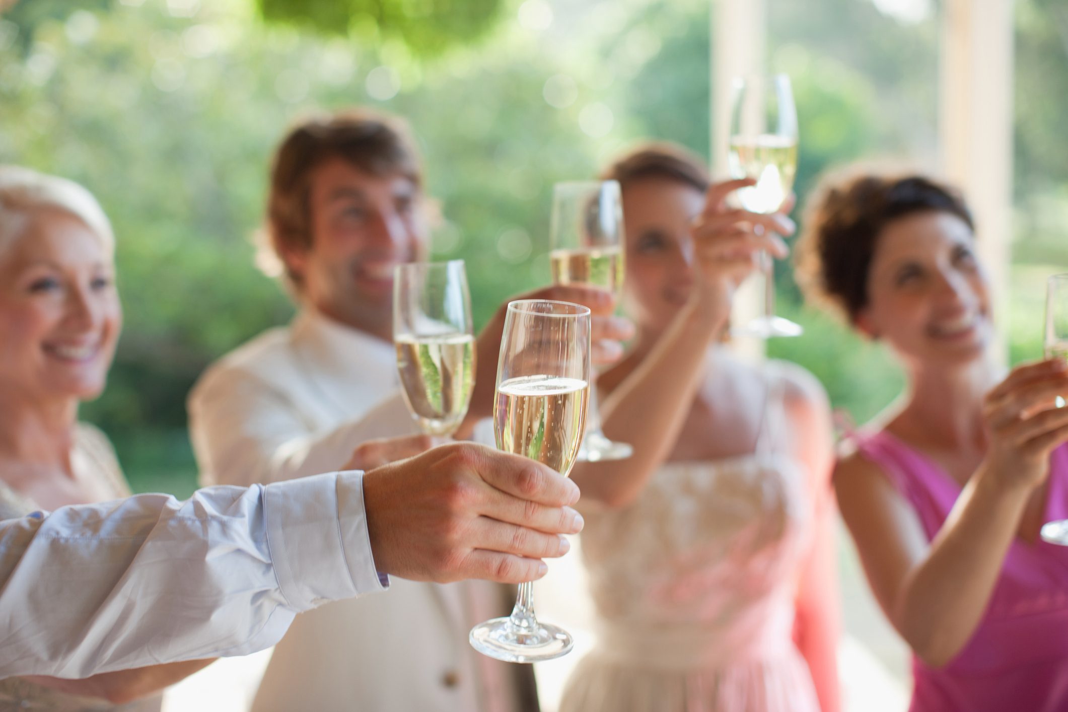 Guests toasting with champagne at wedding reception