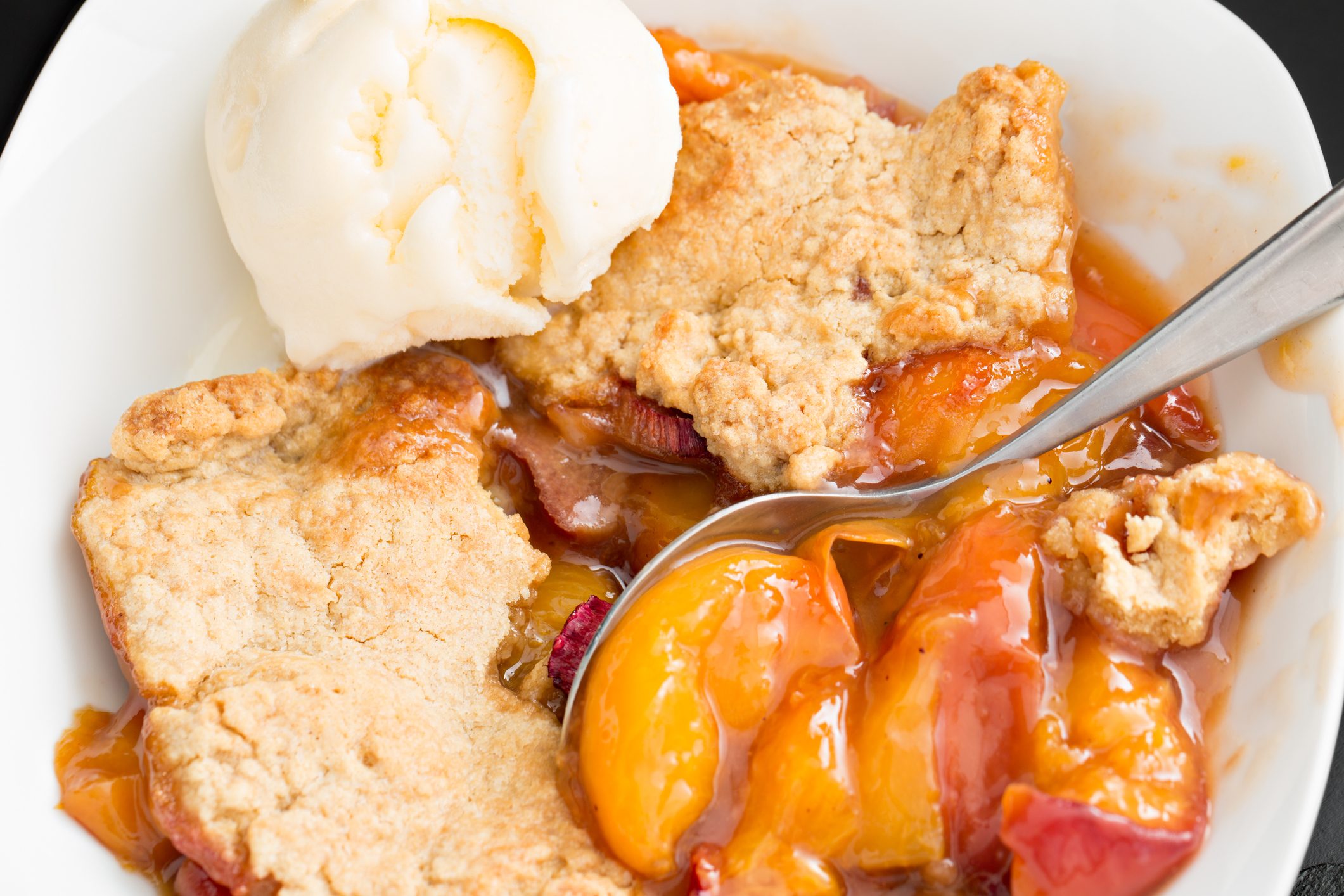 Peach Cobbler And Vanilla Ice Cream in bowl