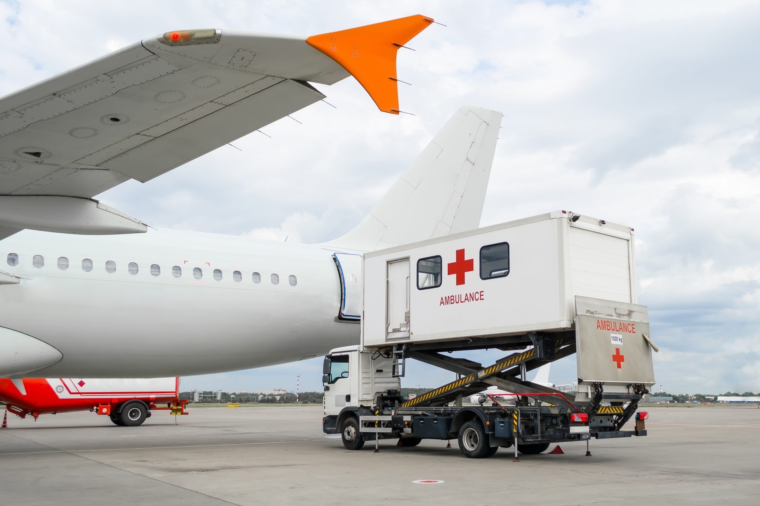 Airplane at the airport with loading ladder for disabled people